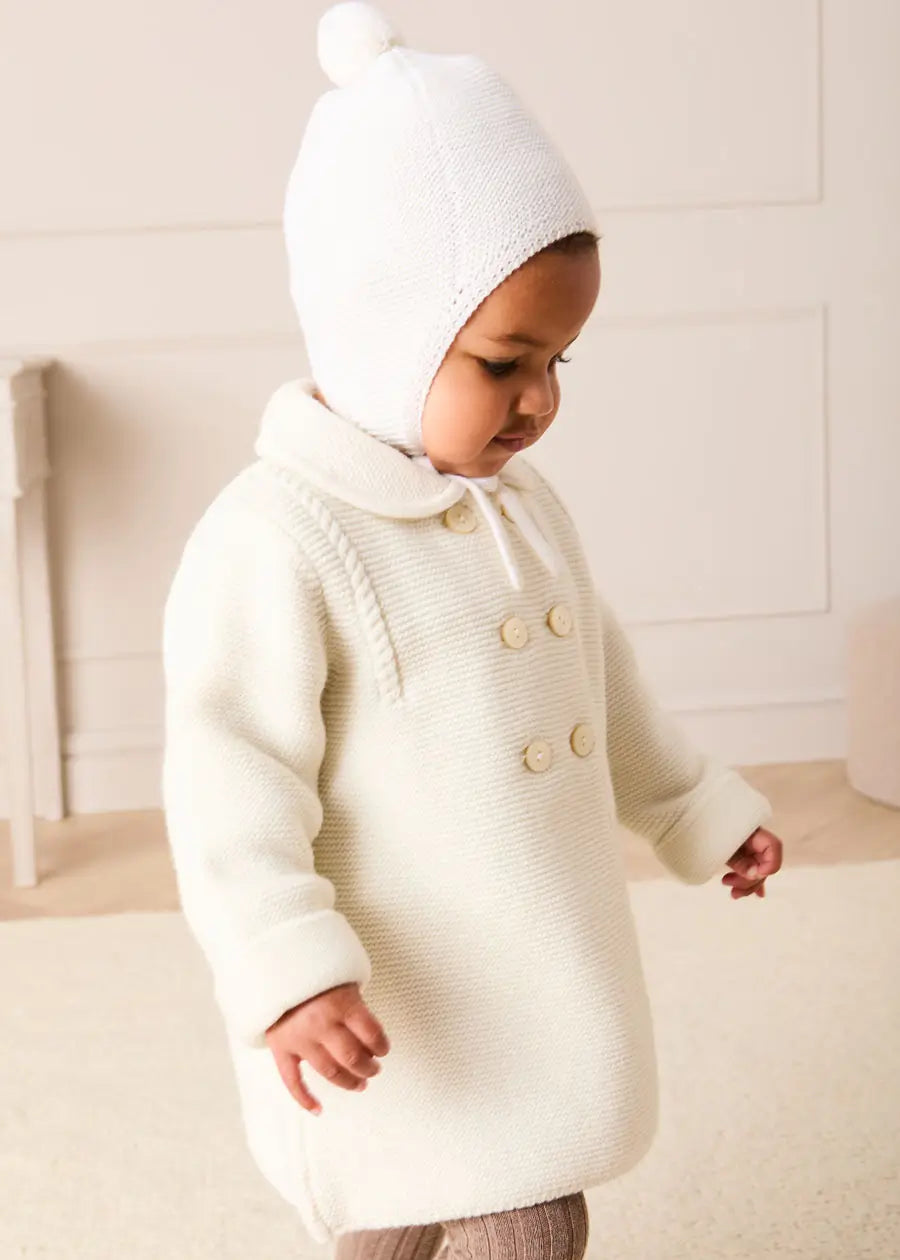 Merino Wool Pom Pom Hat in Cream (S-L) Knitted Accessories from Pepa London US