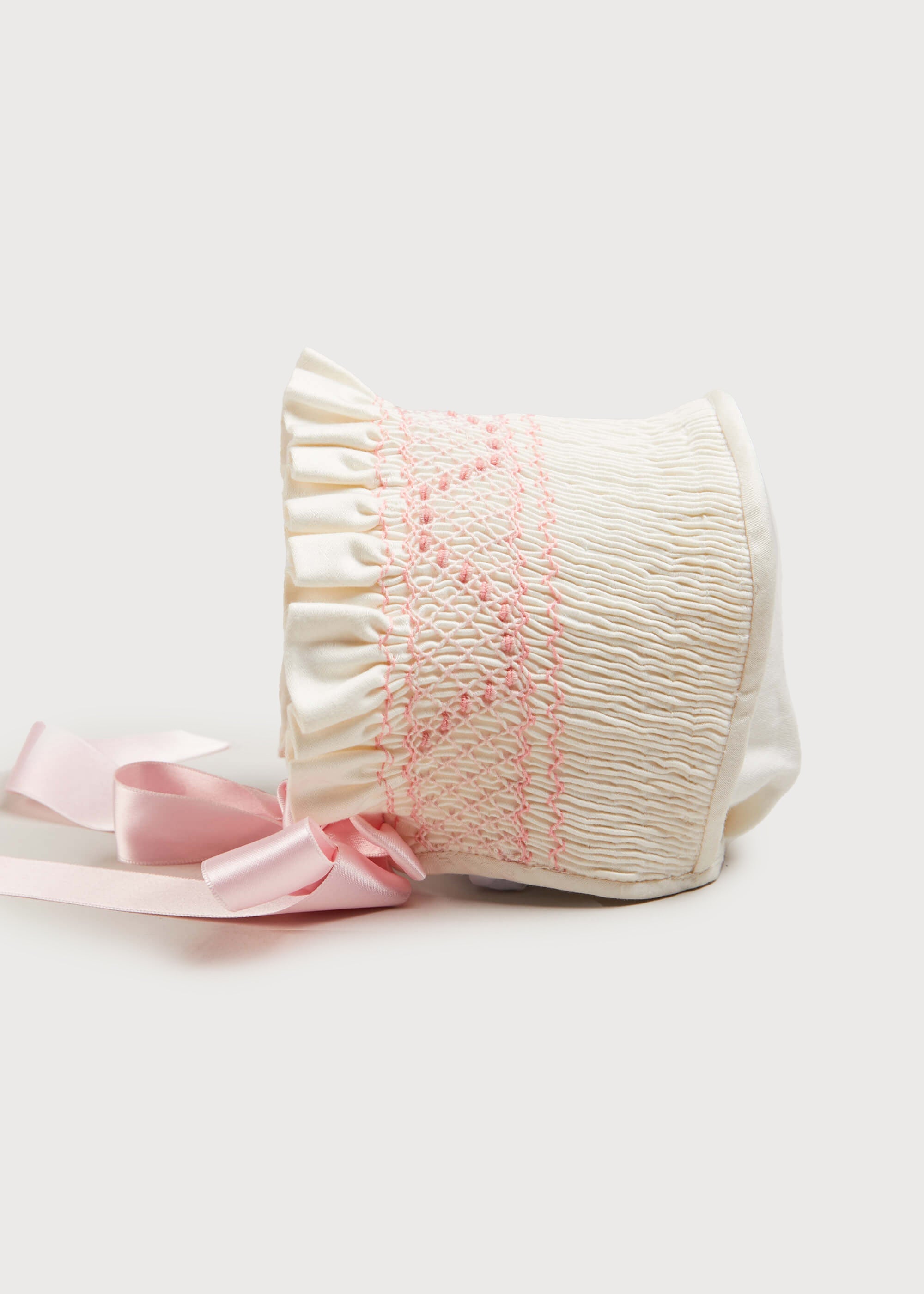 Off White and Pink Hand Smocked Baby Bonnet KNITTED ACCESSORIES from Pepa London US