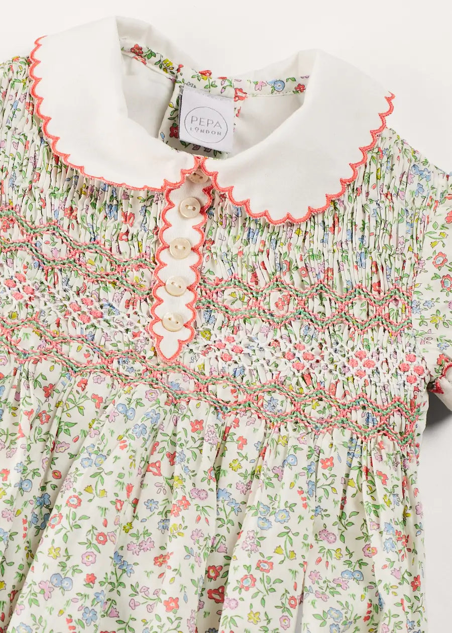 Cordelia Floral Hand-Smocked Short Sleeve Romper in Pink Made with Liberty Fabric (3m-2yrs) ROMPERS from Pepa London US