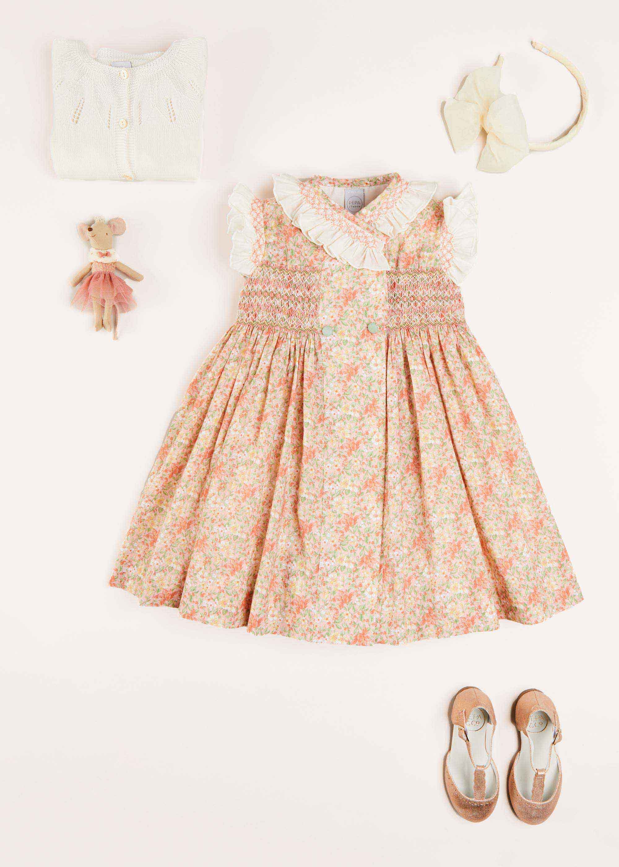 Sophie Floral Print Hand Smocked Double Breasted Dress in Peach (12mths-10yrs) Dresses from Pepa London US