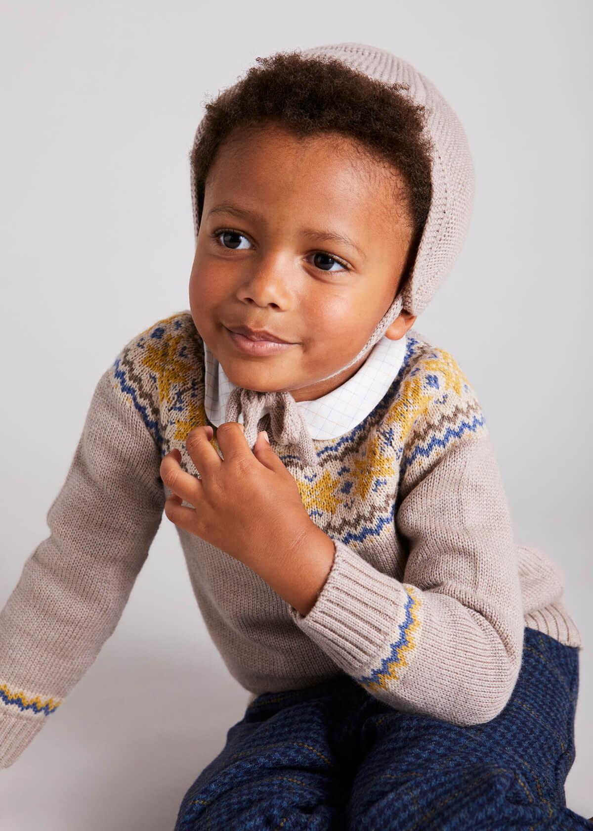 Knitted Merino Wool Winter Bonnet in Oatmeal (S-L) Knitted Accessories  from Pepa London US