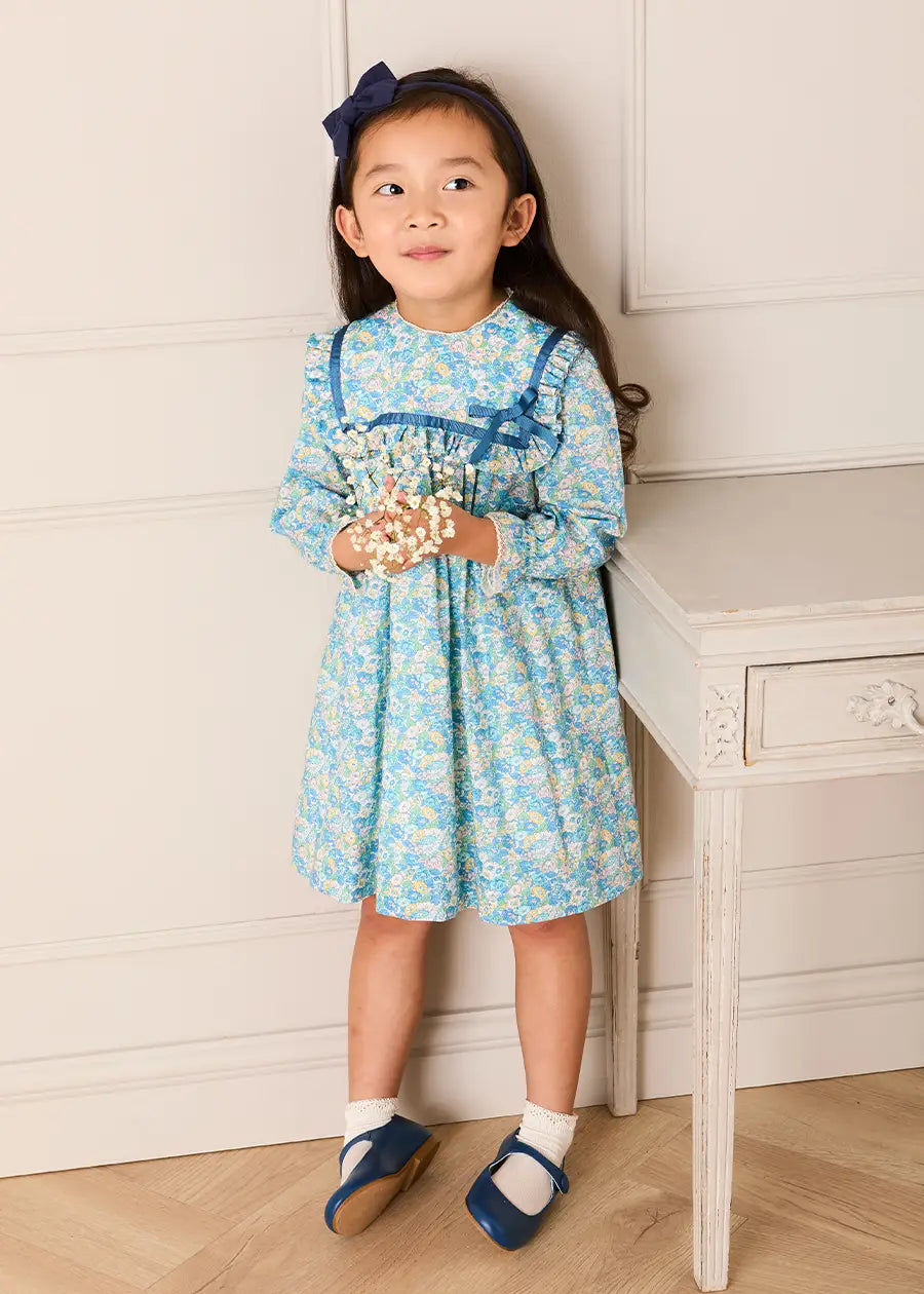 Leontyne Floral Bow Detail Long Sleeve Trapeze Dress in Blue Made with Liberty Fabric (18mths- 10yrs) Dresses from Pepa London US
