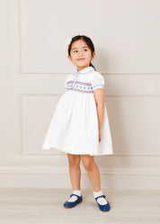 Hand Smocked Plumetti Short Sleeve Dress in White (12mths-6yrs) Dresses from Pepa London US